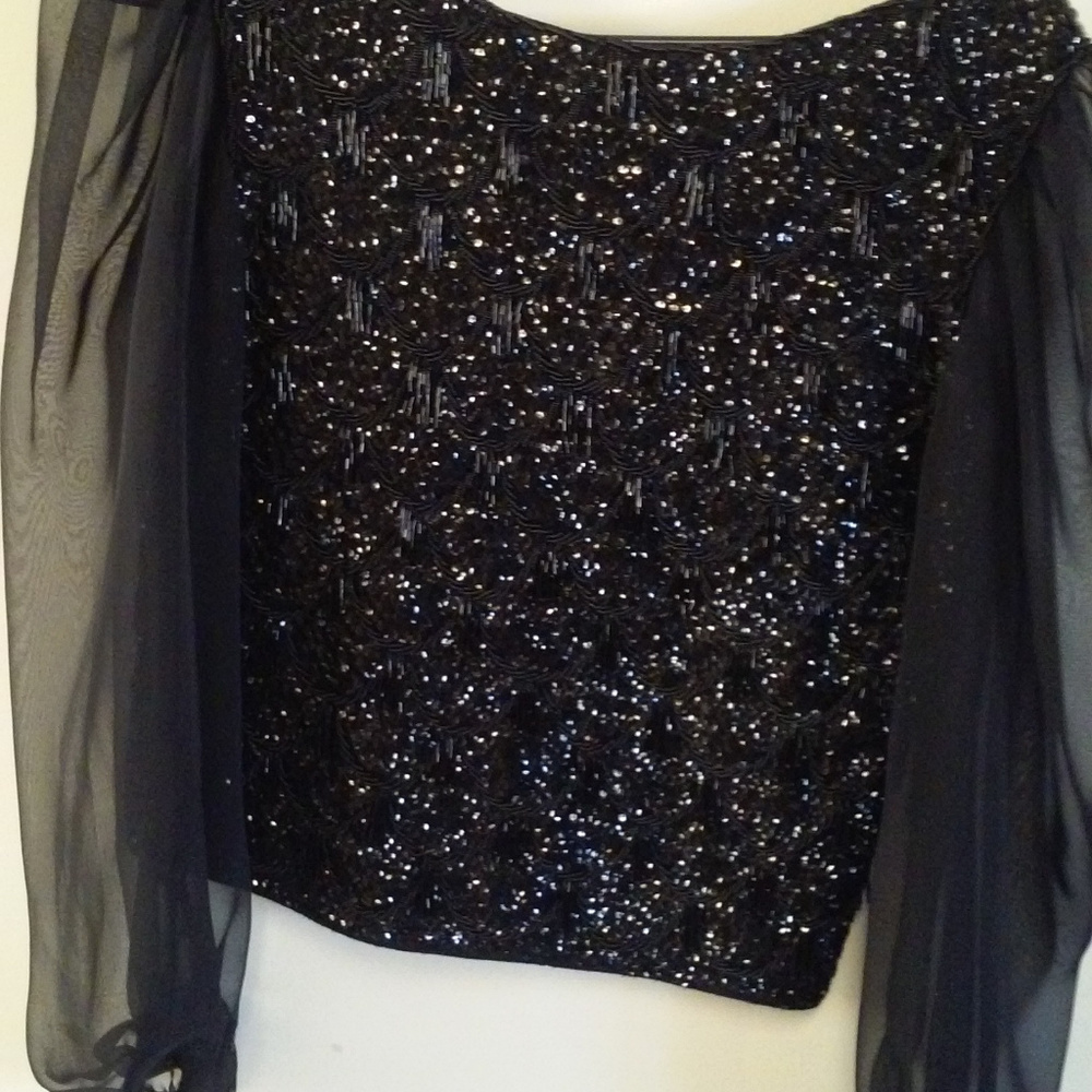 Long sleeve beaded black top.